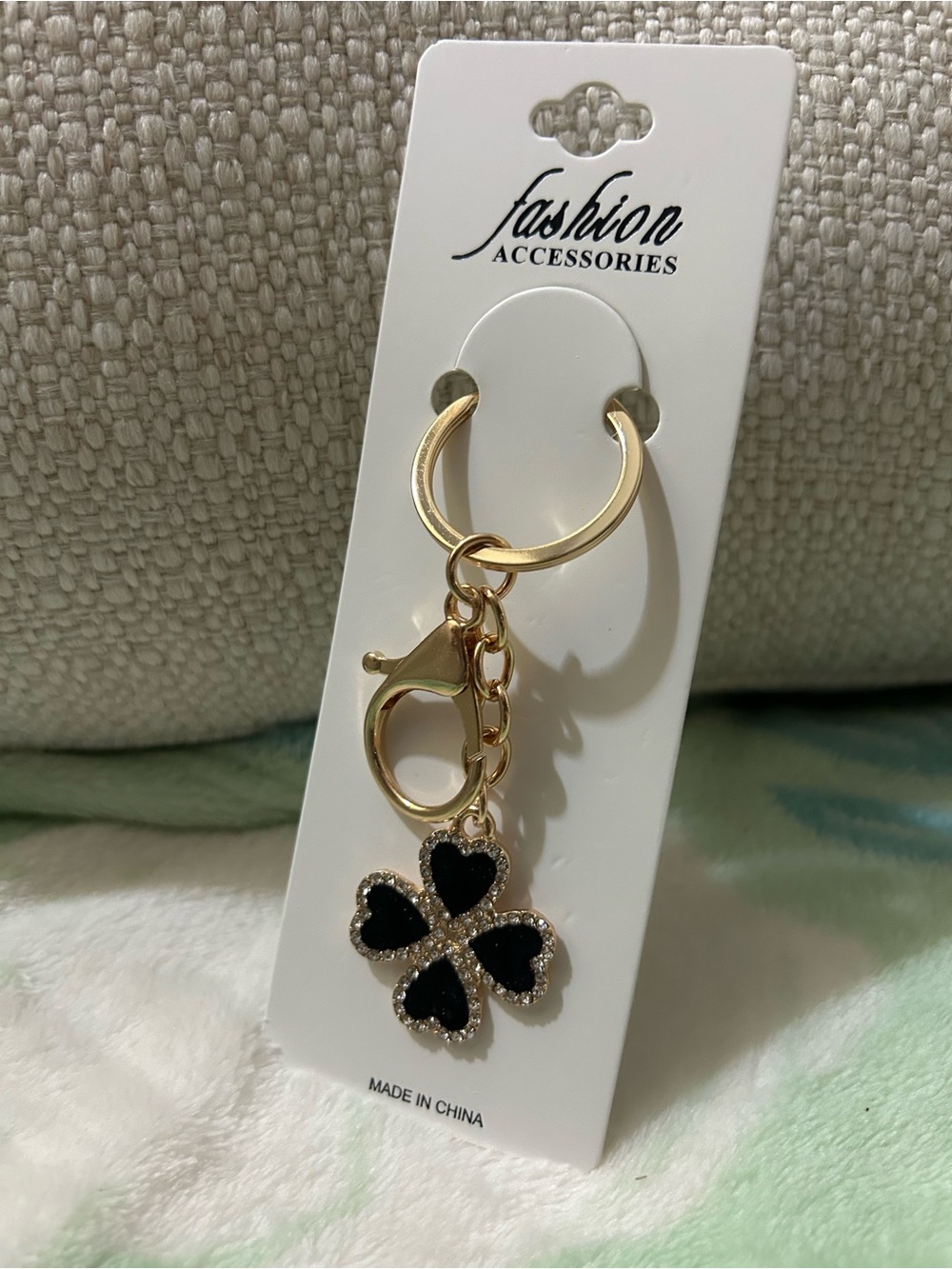 Gold Keychain with Black Four-Leaf Clover Charm
